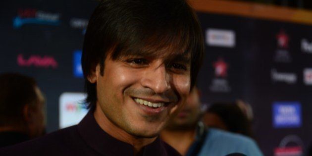 Presenter of IIFA Rocks and Nominee for Best performance in a Negative Role Bollywood actor Vivek Oberoi speaks to the media on the green carpet at the Tampa Convention Center ahead of IIFA Rocks on the second day of the 15th International Indian Film Academy (IIFA) Awards in Tampa, Florida, April 24, 2014. AFP PHOTO FREDERIC J. BROWN (Photo credit should read FREDERIC J. BROWN/AFP/Getty Images)