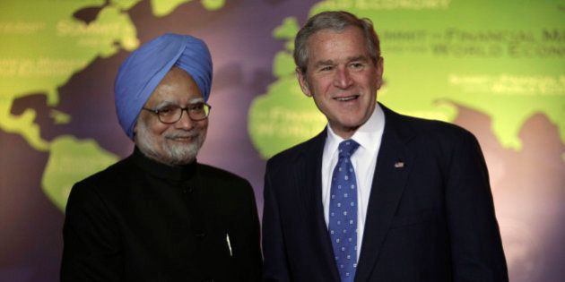 President George W. Bush, right, shakes hands with Indian Prime Minister Manmohan Singh on Saturday, Nov. 15, 2008 in Washington, at the Summit on Financial Markets and the World Economy. (AP Photo/Evan Vucci)
