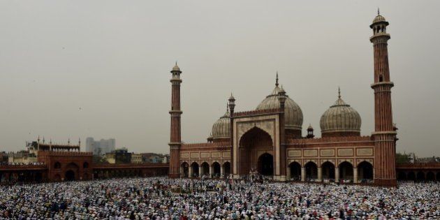 Indian Muslims offer prayers during Eid al-Fitr at Jama Masjid mosque in New Delhi on July 18, 2015. Muslims around the world are celebrating the Eid al-Fitr festival, which marks the end of the fasting month of Ramadan. AFP PHOTO / MONEY SHARMA (Photo credit should read MONEY SHARMA/AFP/Getty Images)