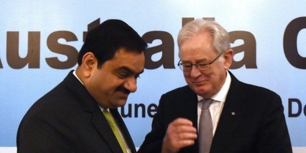 Chairman and founder of India's Adani Group, Gautam Adani (L) speaks with Australia's Trade and Investment Minister Andrew Robb during a photo opportunity at the Australia India CEO Forum in New Delhi on June 23, 2015. AFP PHOTO/MONEY SHARMA (Photo credit should read MONEY SHARMA/AFP/Getty Images)