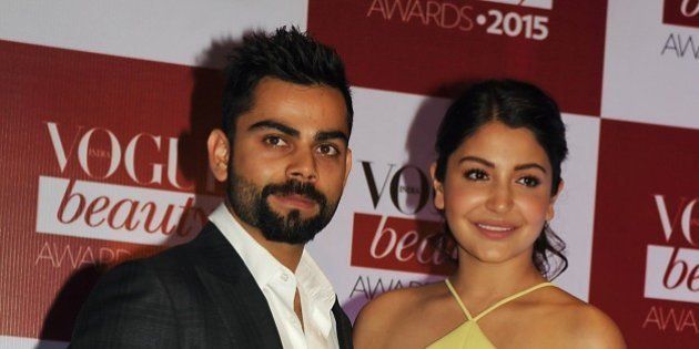 Indian Bollywood actress Anushka Sharma and Indian cricketer Virat Kohli (L) attend the Vogue Beauty Awards ceremony in Mumbai late on July 21, 2015. AFP PHOTO (Photo credit should read STR/AFP/Getty Images)