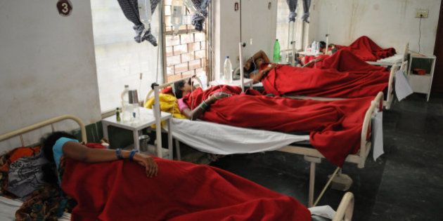 Indian women who underwent sterilization surgeries receive treatment at the District Hospital in Bilaspur, in the central Indian state of Chhattisgarh, Wednesday, Nov. 12, 2014, after at least a dozen died and many others fell ill following similar surgery. The surgeon who performed the operations at the government-run
