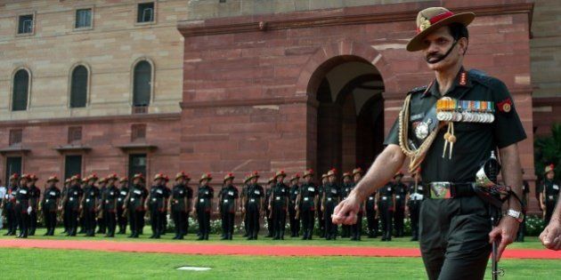 Incoming head of the Indian Army Lt. General Dalbir Singh Suhag inspects a guard of honour prior to joining office in New Delhi on August 1, 2014. Lt Gen Dalbir Singh Suhag has taken over as the head of the 1.3 million strong Indian Army, succeeding General Bikram Singh. AFP PHOTO/Prakash SINGH (Photo credit should read PRAKASH SINGH/AFP/Getty Images)