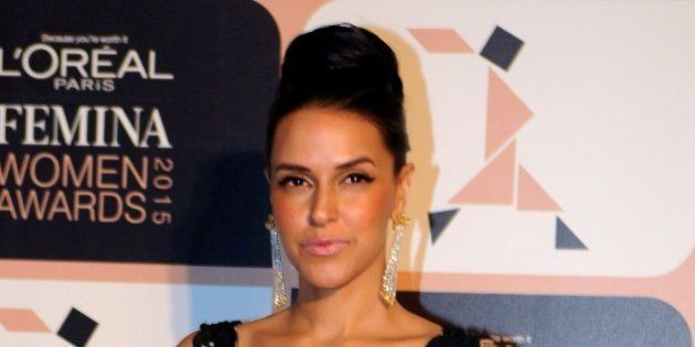 Indian Bollywood actress Neha Dhupia poses as she attends LOreal Paris Femina Women Awards 2015 ceremony in Mumbai late March 23, 2015. AFP PHOTO/STR (Photo credit should read STRDEL/AFP/Getty Images)