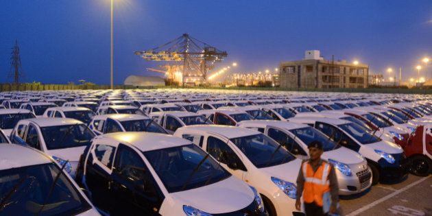Maruti Suzuki Alto cars to be exported out of India are parked in a holding area at Adani Ports and Special Economic Zone (APSEZ) in Mundra, some 400 kms from Ahmedabad. The country's largest car-maker Maruti Suzuki India from Japan's Suzuki Motor Corp declared recently that domestic sales declined around 14 percent in May, while exports fell 27.1 percent. Adani Ports and Special Economic Zone Limited (APSEZ) is India's largest private port and special economic zone. AFP PHOTO / Sam PANTHAKY (Photo credit should read SAM PANTHAKY/AFP/Getty Images)