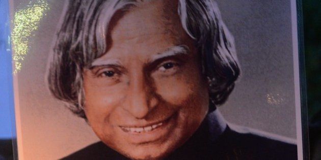 Indian students walk with a photograph of India's former president and top scientist A. P. J. Abdul Kalam during a candle light vigil in his memory in Mumbai on July 28, 2015. Avul Pakir Jainulabdeen Abdul Kalam, commonly known as India's missile man for his role in the country's nuclear weapons tests, collapsed during a lecture at a management institute in the northeastern Indian city of Shillong, and was declared dead on arrival by doctors at the city's Bethany hospital. India declared seven days of national mourning for Avul Pakir Jainulabdeen Abdul Kalam, who served as India's 11th president between 2002 and 2007, as is standard after the death of a former leader. AFP PHOTO / INDRANIL MUKHERJEE (Photo credit should read INDRANIL MUKHERJEE/AFP/Getty Images)