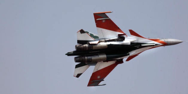 An Indian Air Force Sukhoi SU-30 air superiority fighter flies past during a flight demonstration at the Yelahanka Air Force Station during the second day of Aero India 2009 in Bangalore on February 12, 2009. South Asia's biggest airshow opened with firms from 25 countries showcasing their latest hardware in a chase for multibillion-dollar contracts with the Indian military. AFP PHOTO/Dibyangshu SARKAR (Photo credit should read DIBYANGSHU SARKAR/AFP/Getty Images)