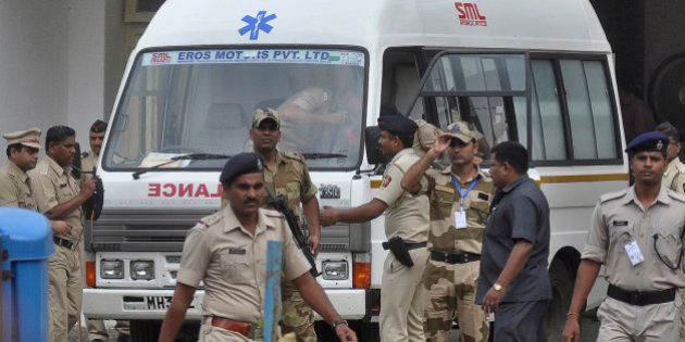 An ambulance carrying the body of Yakub Abdul Razak Memon stands at Dr Babasaheb Ambedkar airport as it waits to transport Memon's body to Mumbai from Nagpur, India, Thursday, July 30, 2015. Memon, 53, an Indian accountant and the only person sentenced to death for his role in the 1993 Mumbai bombings that killed 257 people â the country's worst terrorist attack â was hanged Thursday on his birthday, after the president rejected a last-minute mercy plea amid a debate over the capital punishment. (AP Photo)