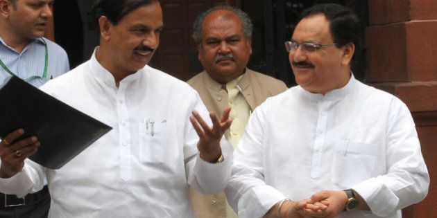 NEW DELHI, INDIA - JUNE 24: Union Minister for Arts and Culture Mahesh Sharma, Union Minister for Health and family Welfare JP Nadda, Union Minister for Steel Narendra Singh Tomar ( C ) coming out after Cabinet Meeting at Prime Minister Office, South Block on June 24, 2015 in New Delhi, India. (Photo by Arvind Yadav/Hindustan Times via Getty Images)