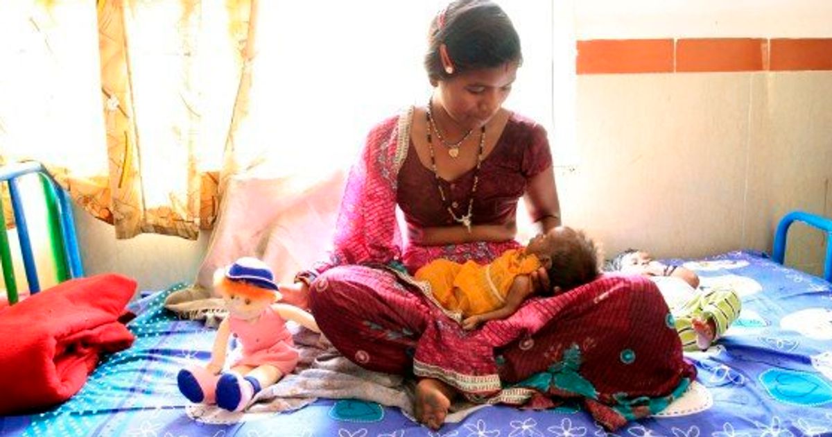 Tamil mother feeding sales child