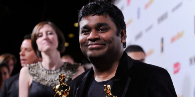 Indian composer AR Rahman holds his two Oscars for Best Song and Best Original Score for