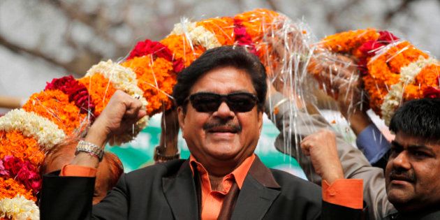 Bharatiya Janata Party leader and Bollywood actor Shatrughan Sinha, is garlanded in an election campaign rally in Allahabad, India, Monday, Feb. 13, 2012. India's largest state Uttar Pradesh is currently going to the polls in seven-phases in a month long local election with repercussions for the whole nation. (AP Photo/Rajesh Kumar Singh)