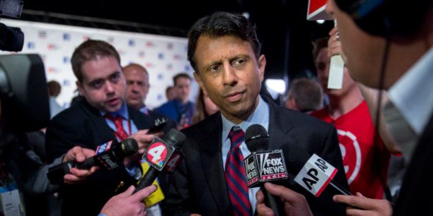 Bobby Jindal, governor of Louisiana and 2016 Republican presidential candidate, speaks to the media in the spin area after a televised forum ahead of the first Republican presidential debate at Quicken Loans Arena in Cleveland, Ohio, U.S., on Thursday, Aug. 6, 2015. Seven candidates in the forum, hosted by Fox News and Facebook Inc. in conjunction with the Ohio Republican Party, were omitted from the prime-time debate stage after they didn't make the top 10 of an average of the five most recent national polls as recognized by Fox News. Photographer: Andrew Harrer/Bloomberg via Getty Images