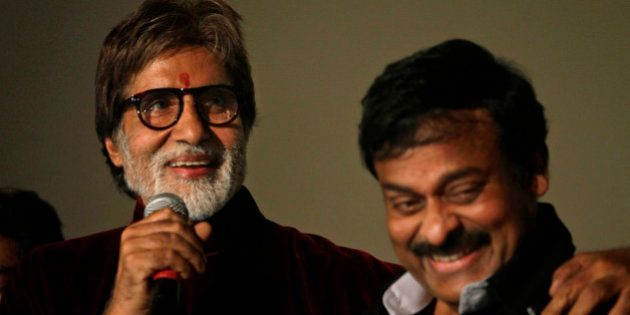 Indian actor Amitabh Bachchan, left, and Telugu film industry super star Chiranjeevi address the media during the premiere of Bachchan's latest movie
