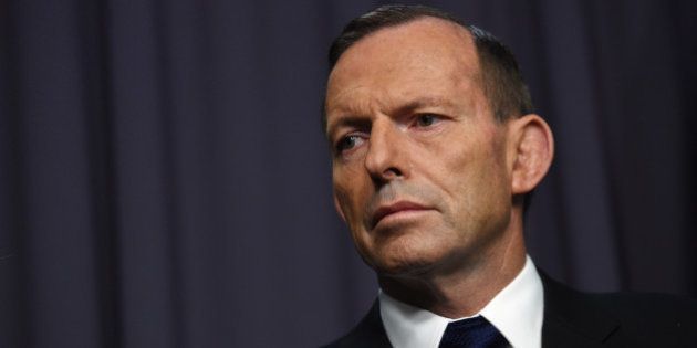Australian Prime Minister Tony Abbott pauses as he speaks to the media during a press conference at Parliament House in Canberra, Australia, Wednesday, April 29, 2015. Abbott announced that Australia will withdraw its ambassador from Jakarta in response to the still unconfirmed executions of two Australians, Myuran Sukumaran, 33, and Andrew Chan, 31. (Lukas Coch/AAP Image via AP) NO ARCHIVING, AUSTRALIA OUT, NEW ZEALAND OUT, PAPUA NEW GUINEA OUT, SOUTH PACIFIC OUT