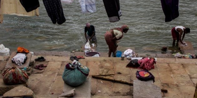 VARANASI, UTTAR PRADESH, INDIA - 2015/07/10: A man washing clothes on Ghats of Ganga river in Varanasi. Banaras or Varanasi is a spiritual city, full of traffic and many other things which only can be felt. Varanasi is also the oldest living city of world. (Photo by Akshay Gupta/Pacific Press/LightRocket via Getty Images)