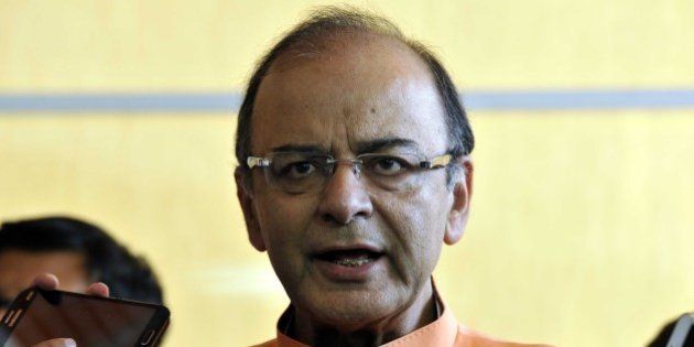 NEW DELHI, INDIA - JULY 22: Finance Minister Arun Jaitley addresses the media after the adjournment of Rajya Sabha during the Parliament monsoon session at Parliament House, on July 22, 2015 in New Delhi, India. Both Houses of Parliament were adjourned for the day on Wednesday as the opposition kept up with its protest over the controversies involving senior Bharatiya Janata Party (BJP) leaders and rejected the government's demand for a discussion on the issues. In Rajya Sabha, finance minister defended External Affairs Minister Sushma Swaraj, who is facing opposition heat for allegedly supporting tainted former IPL Chief Lalit Modi's bid for British travel papers. (Photo by Sonu Mehta/Hindustan Times via Getty Images)