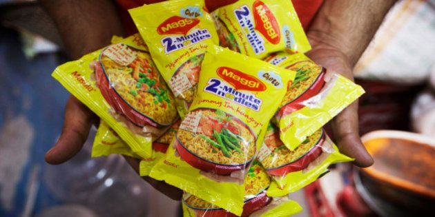 Packets of Maggi 2-Minute Noodles, manufactured by Nestle India Ltd., which were located behind the counter at a store are displayed for a photograph in New Delhi, India, on Monday, June 15, 2015. Nestle SA said the U.S. Food and Drug Administration is testing samples of imported Maggi noodles after the worlds largest food company halted sales in India when regulators said they contained unhealthy levels of lead. Photographer: Kuni Takahashi/Bloomber