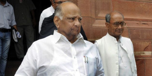 NEW DELHI, INDIA - AUGUST 10: NCP Chief Sharad Pawar and Congress Party General Secretary Digvijaya Singh at Parliament during the monsoon session on August 10, 2015 in New Delhi, India. The government will tomorrow bring the much-awaited bill on GST for passage in the Rajya Sabha even as doubts persist if the opposition Congress will allow passage of the Constitution Amendment Bill. (Photo by Sonu Mehta/Hindustan Times via Getty Images)