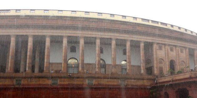 NEW DELHI, INDIA - AUGUST 11: Heavy rain at Parliament House during the monsoon session on August 11, 2015 in New Delhi, India. The lower house saw noisy scenes till its adjournment for the day in the post-lunch session with members from the treasury benches also intermittently raising slogans against Congress leaders. (Photo by Arvind Yadav/ Hindustan Times via Getty Images)