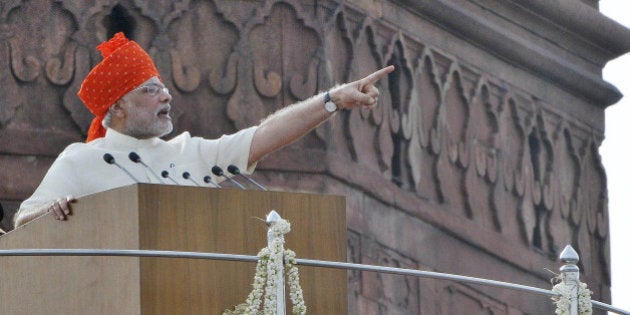 NEW DELHI, INDIA - AUGUST 15: Prime Minister Narendra Modi addressing the nation on 68th Independence Day at the Red Fort on August 15, 2014 in New Delhi, India. In first I-Day speech, Narendra Modi listed his governments priorities and announced schemes to empower the poor, develop a skilled workforce, unleash the entrepreneurial potential of the youth, and ensure toilets, especially for girls, in every school. (Photo by Sonu Mehta/Hindustan Times via Getty Images)