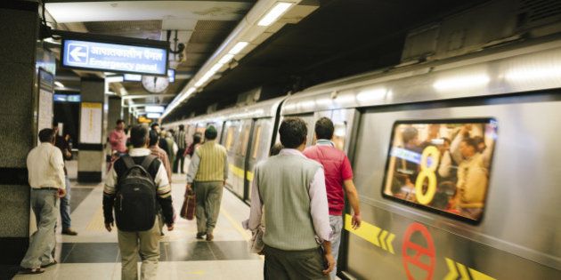People on a subway station platform, New Delhi