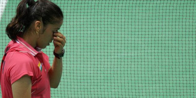 India's Saina Nehwal reacts after losing a point to Indonesia's Maria Kristina Yulianti during their women's singles quarter-final badminton match for the 2008 Beijing Olympic Games at the Beijing University of Technology Gymnasium on August 13, 2008. AFP PHOTO/Indranil MUKHERJEE (Photo credit should read INDRANIL MUKHERJEE/AFP/Getty Images)