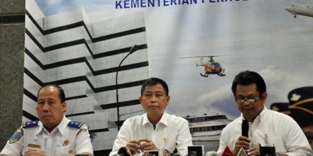 JAKARTA, INDONESIA - AUGUST 16: Indonesia's Transport Minister Ignasius Jonan (C) speaks during a press conference in Jakarta on August 16, 2015, announcing that a missing plane carrying 54 people crashed into a mountain in eastern Indonesian province of Papua. Indonesian authorities say a plane that went missing earlier Sunday with 54 passengers on board has been found after it crashed into mountains in eastern Papua. (Photo by Wawan Kurniawan/Anadolu Agency/Getty Images)