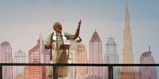 Indian Prime Minister Narendra Modi delivers a speech to members of the Indian expatriate community in the United Arab Emirates at the Dubai Cricket Stadium, on August 17, 2015, during a two-day visit to the UAE. Modi is the first Indian premier to visit the UAE in more than three decades since Indira Gandhi came in 1981 and is due to address the country's large India expat community in Dubai. Indians, who form the UAE's largest expatriate community, account for about 30 percent of the country's population of eight million, with many of them labourers who were behind the construction boom. AFP PHOTO / KARIM SAHIB (Photo credit should read KARIM SAHIB/AFP/Getty Images)