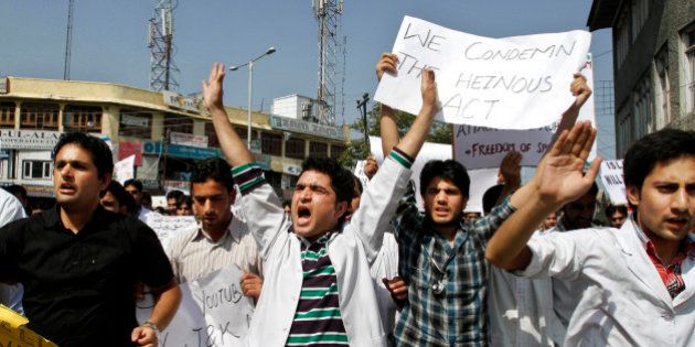Kashmiri medical students shout slogans against the United States as they march in a protest rally against an anti-Islam film called