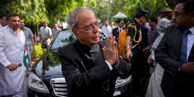 Indian President Pranab Mukherjee greets all well-wishers as he arrives to attend the funeral of his wife Suvra Mukherjee in New Delhi, India, Wednesday, Aug. 19, 2015. Suvra Mukherjee died Tuesday at age 74. (AP Photo/Saurabh Das, Pool)