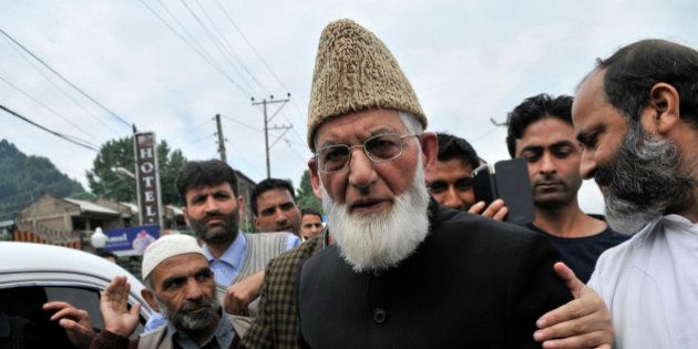 SRINAGAR, INDIA - JUNE 5: Hurriyat Conference chairman Syed Ali Shah Geelani arrives at Regional passport office to fill passport details for travel documents on June 5, 2015 in Srinagar, India. Separatist leader Syed Ali Shah Geelani today appeared before passport authorities and declared himself as an Indian while completing formalities for travel documents but insisted that he did it out of compulsion. The Home and External Affairs ministries had a fortnight back said that Geelani's passport application was incomplete and could not be processed. (Photo by Waseem Andrabi/Hindustan Times via Getty Images)
