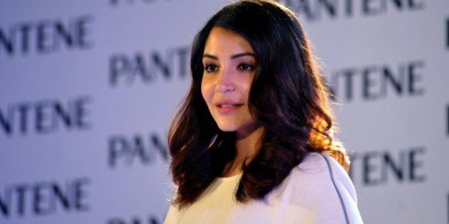 Indian Bollywood actress Anushka Sharma appears as brand ambassador for Pantene's Bianca Hartkopf range in Mumbai late on July 29, 2015. AFP PHOTO (Photo credit should read STR/AFP/Getty Images)