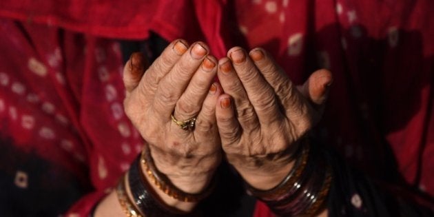 An Indian Muslim woman offers prayers during the holy month of Ramadan at the Jama Masjid in the old quarters of New Delhi on July 6, 2015. Across the Muslim world, the faithful fast from dawn to dusk, and abstain from eating, drinking, smoking and having sex during that time as they strive to be more pious and charitable. AFP PHOTO / SAJJAD HUSSAIN (Photo credit should read SAJJAD HUSSAIN/AFP/Getty Images)