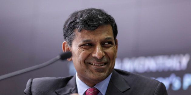 Raghuram Rajan, governor of the Reserve Bank of India (RBI), smiles during a news conference in Mumbai, India, on Tuesday, Aug 4, 2015. Rajan kept interest rates unchanged, rebuffing pressure from the Finance Ministry to reduce borrowing costs that are among the highest in Asia. Photographer: Dhiraj Singh/Bloomberg via Getty Images