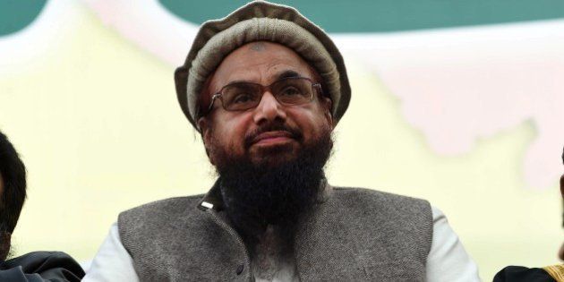 Hafiz Muhammad Saeed (C), head of the banned Pakistani charity organisation, Jamaat-ud-Dawa (JuD) attends a protest to mark Kashmir Solidarity day in Lahore on February 5, 2015. Pakistan observed Kashmir Solidarity Day on February 5 to denounce Indian rule in the disputed Himalayan region, claimed in whole by both countries. AFP PHOTO / ARIF ALI (Photo credit should read Arif Ali/AFP/Getty Images)