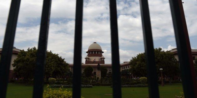A view of the Indian Supreme Court in New Delhi on July 28, 2015. India's Supreme court refered Yakub Memon's petition against his death sentence for his role in the 1993 Mumbai bomb blasts to a larger bench after a two judge bench delivered a split verdict. AFP PHOTO / SAJJAD HUSSAIN (Photo credit should read SAJJAD HUSSAIN/AFP/Getty Images)