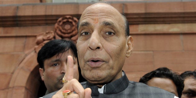 NEW DELHI, INDIA - AUGUST 6: Union Home Minister Rajnath Singh talking with media persons after attending the Parliament Monsoon Session on August 6, 2015 in New Delhi, India. The Lok Sabha passed a bill providing for filing of cheque bounce cases at the places where it is presented. (Photo By Sonu Mehta/Hindustan Times via Getty Images)