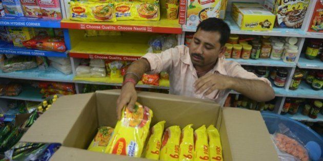 An Indian shopkeeper removes packets of Nestle 'Maggi' instant noodles from the shelves in his shop in Siliguri on June 5, 2015. India's food safety regulator on June 5 banned the sale and production of Nestle's Maggi instant noodles over a health scare after tests found they contained excessive lead levels. AFP PHOTO/Diptendu DUTTA (Photo credit should read DIPTENDU DUTTA/AFP/Getty Images)