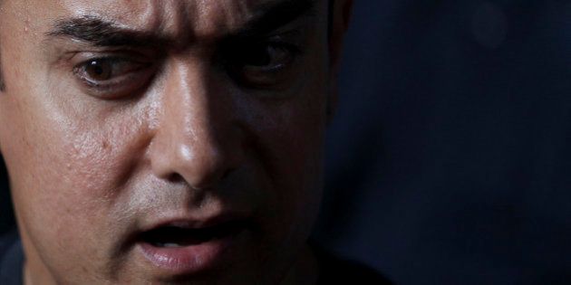 Bollywood actor Aamir Khan speaks during a media interaction on completion of his 25 years in Indian cinema, in Mumbai, India, Monday, April 29, 2013. (AP Photo/Rafiq Maqbool)