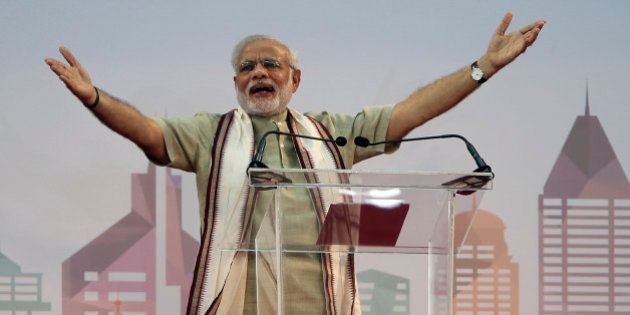 Indian Prime Minister Narendra Modi addresses Indian expatriates at a cricket stadium, Monday, Aug. 17, 2015, in Dubai, United Arab Emirates. The UAE is home to over two million Indian expatriates and this is the first visit by an Indian premier in over three decades. (AP Photo/Kamran Jebreili)