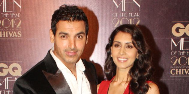 MUMBAI, INDIA - SEPTEMBER 30: Indian Bollywood actor John Abraham with girlfriend Priya Runchal during the GQ Men of the Year Awards 2012 ceremony in Mumbai on September 30, 2012. (Photo by Yogen Shah/India Today Group/Getty Images)