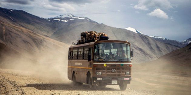 A bus travels along the Leh Manali highway in Ladakh region, Jammu and Kashmir, India, on Saturday, Aug. 8, 2015. India is scheduled to release second-quarter gross domestic product figures on Aug. 31. Photographer: Prashanth Vishwanathan/Bloomberg via Getty Images