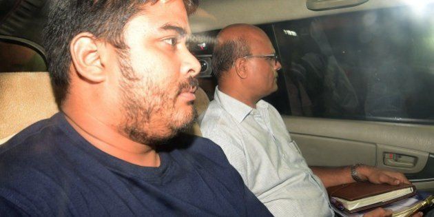 Mikhail Bora, the son of former Indian media executive Indrani Mukherjea, leaves a police station in Mumbai on August 28, 2015. A former Indian media executive has been arrested on suspicion of murdering her daughter for having an affair with her stepson, Mumbai police said August 27, in a case gripping India. Indrani Mukerjea is accused, along with two others, of strangling Sheena Bora to death in 2012 before dumping her body in a forest in western Maharashtra state and setting it alight. AFP PHOTO (Photo credit should read STR/AFP/Getty Images)