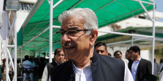 Pakistan's Defense Minister Khawaja Muhammad Asif leaves the Parliament after attending a joint session to discuss the crisis in Yemen, in Islamabad, Pakistan, Friday, April 10, 2015. Pakistan's parliament on Friday decided not to join the Saudi-led coalition targeting Shiite rebels in Yemen. (AP Photo/B.K. Bangash)