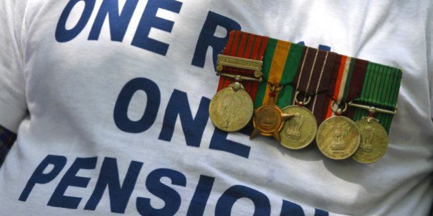 NEW DELHI, INDIA - AUGUST 25: Ex-serviceman with medal participates in a protest over the delay in implementation of One Rank, One Pension (OROP), at Jantar Mantar on August 25, 2015 in New Delhi, India. Col. Pushpender Singh (retd.), who was hospitalised after fasting for nine days over non-implementation of the 'One Rank, One Pension' (OROP), stabilised on but the health of two other veterans deteriorated. (Photo by Virendra Singh Gosain/Hindustan Times via Getty Images)