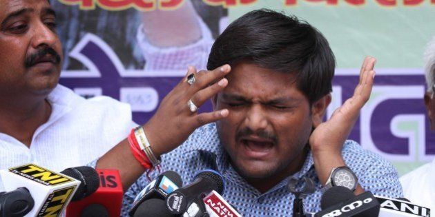 NEW DELHI, INDIA - AUGUST 30: Hardik Patel, Convener of Patidar Anamat Andolan Samiti (PAAS) addresses during a press conference, strongly defended his demand for reservation for Patels or Patidars, saying they are not getting jobs due to reservation, at Press Club, on August 30, 2015 in New Delhi, India. Patel announced that he won't allow any political party to join his agitation and he wants to turn the stir into a national movement. He said, 'We are not here to meet any ministers. Political parties are not welcome in the agitation.' (Photo by Arvind Yadav/Hindustan Times via Getty Images)
