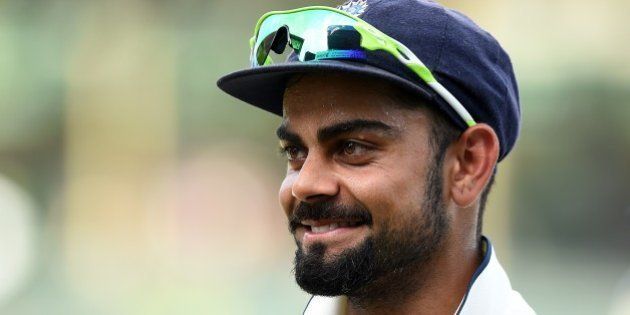 Indian captain Virat Kohli celebrates victory at close of play on the final day of the third and final Test match between Sri Lanka and India at the Sinhalese Sports Club (SSC) in Colombo on September 1, 2015. India defeated Sri Lanka by 117 runs in the third and final Test in Colombo to win a series on the island for the first time since 1993. AFP PHOTO / Ishara S. KODIKARA (Photo credit should read Ishara S.KODIKARA/AFP/Getty Images)