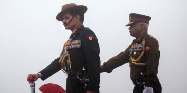 Indian Army Chief General Dalbir Singh Suhag, left, participates in a parade on the occasion of the Indian Army Day in New Delhi, India, Thursday, Jan. 15, 2015. Indian army is one of the largest standing army of the world. (AP Photo/Tsering Topgyal)
