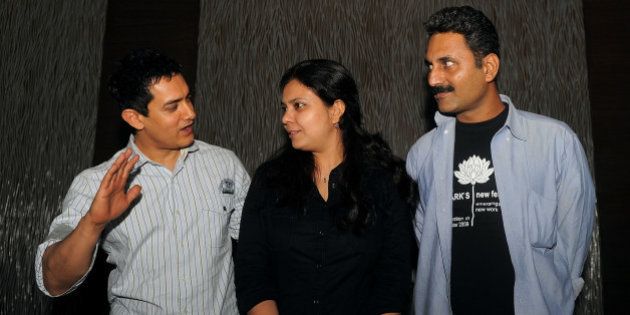 Indian Bollywood Actor Aamir Khan (L), writer and directors Anusha Rizvi (C) and Mahmood Farooqui (R) attend a promotional event for the new film' Peepli Live', in New Delhi on July 7, 2010. Khan produced the Bollywood film 'Peepli Live', written and directed by Anusha Rizvi and is scheduled to be relased on August 13. AFP PHOTO/Manan Vatsyayana (Photo credit should read MANAN VATSYAYANA/AFP/Getty Images)